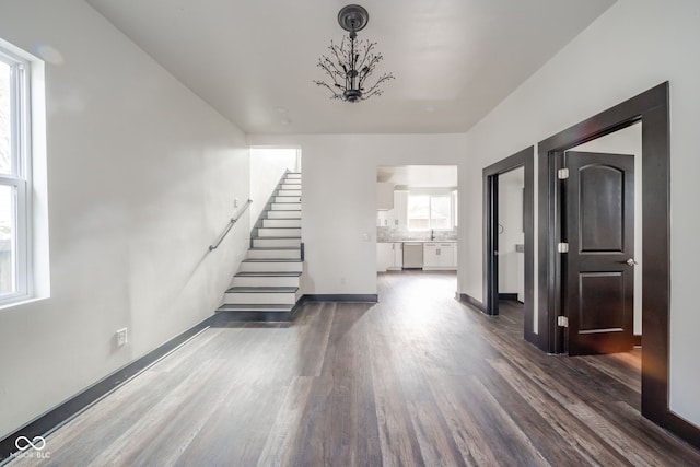 interior space featuring a wealth of natural light and dark wood-type flooring