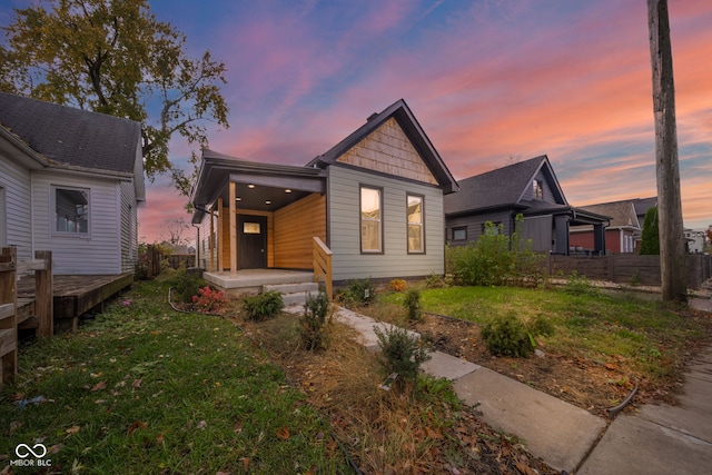 view of front of property with a lawn