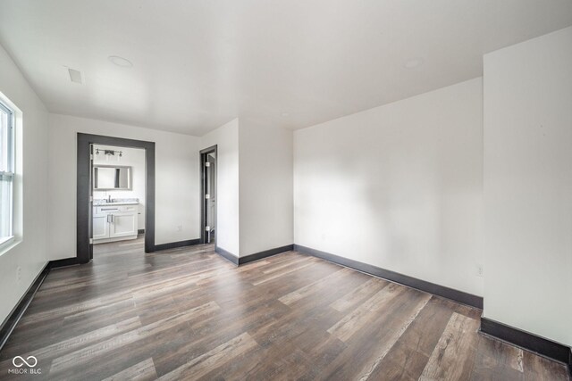 425 Sanders St, Indianapolis, IN 46225 - spare room featuring wood finished floors and baseboards