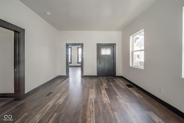 425 Sanders St, Indianapolis, IN 46225 - entryway with dark wood-style flooring and baseboards