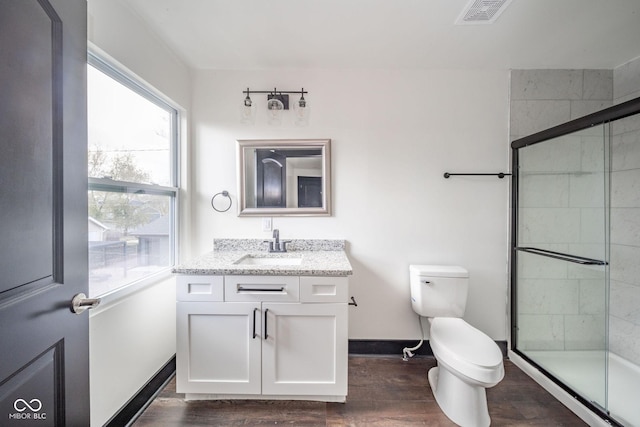425 Sanders St, Indianapolis, IN 46225 - full bathroom with wood finished floors, a shower stall, baseboards, and toilet