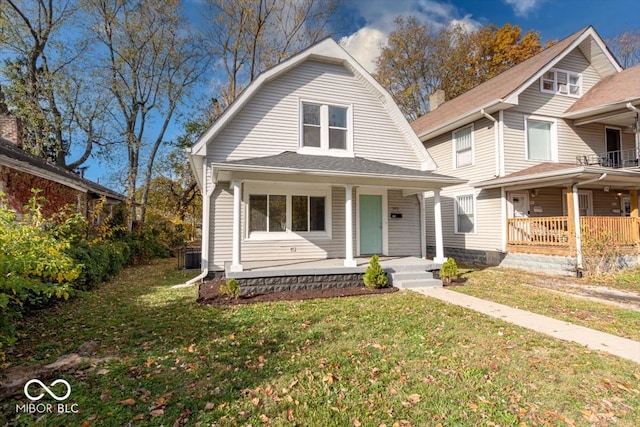 view of front of home featuring a front yard and covered porch