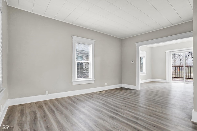 empty room with wood-type flooring