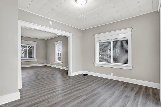 unfurnished room featuring dark hardwood / wood-style floors