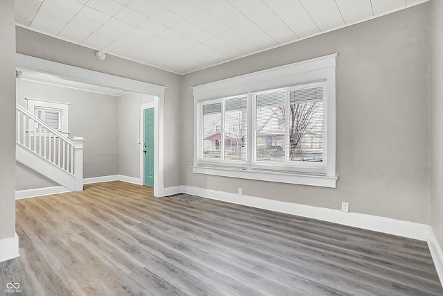 unfurnished living room featuring hardwood / wood-style flooring