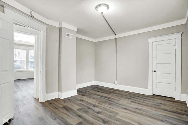 unfurnished room with dark hardwood / wood-style floors