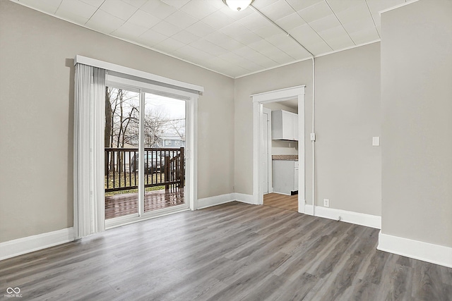 unfurnished room featuring hardwood / wood-style floors