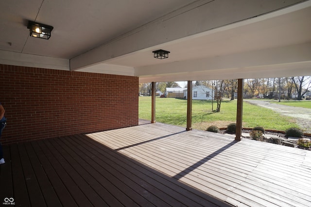 wooden terrace with a yard