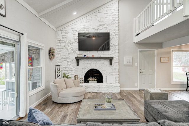 5909 Buttonwood Dr, Noblesville, IN 46062 - living room with baseboards, wood finished floors, a fireplace, beamed ceiling, and high vaulted ceiling