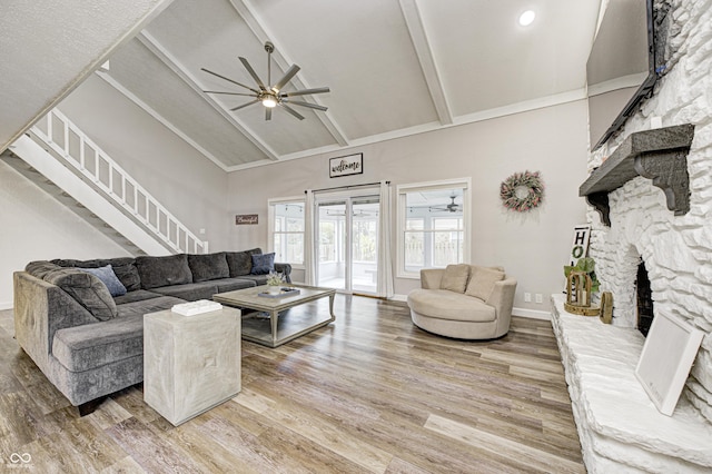 5909 Buttonwood Dr, Noblesville, IN 46062 - living area with a ceiling fan, high vaulted ceiling, wood finished floors, a fireplace, and stairway