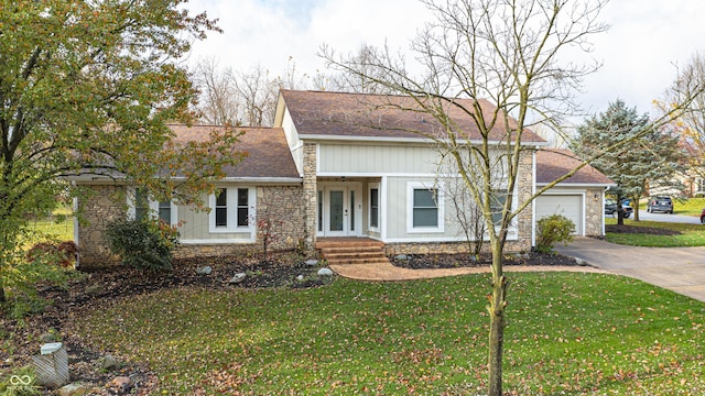 5909 Buttonwood Dr, Noblesville, IN 46062 - view of front of property with a garage, board and batten siding, concrete driveway, and a front yard