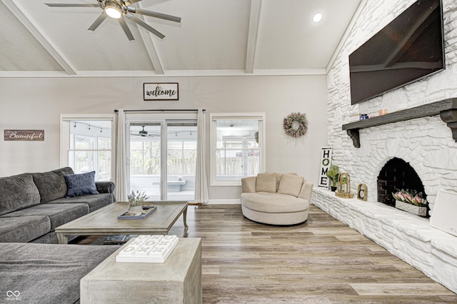 5909 Buttonwood Dr, Noblesville, IN 46062 - living room featuring ceiling fan, wood finished floors, and a stone fireplace