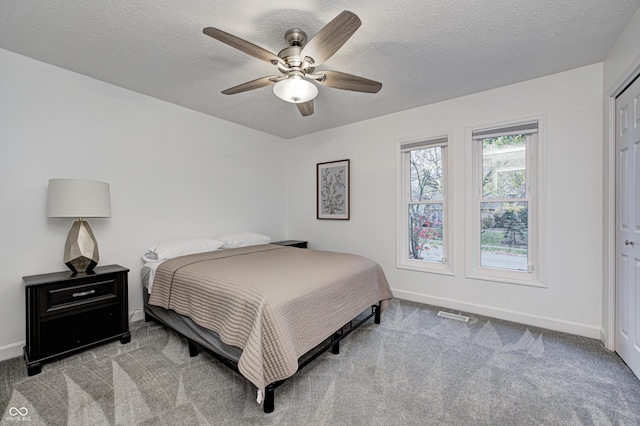 5909 Buttonwood Dr, Noblesville, IN 46062 - bedroom with baseboards, carpet floors, a textured ceiling, and ceiling fan