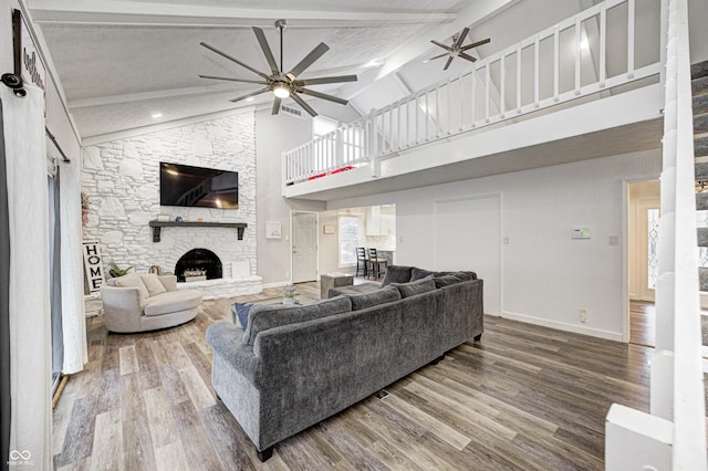 5909 Buttonwood Dr, Noblesville, IN 46062 - living room featuring a ceiling fan, high vaulted ceiling, baseboards, wood finished floors, and a fireplace