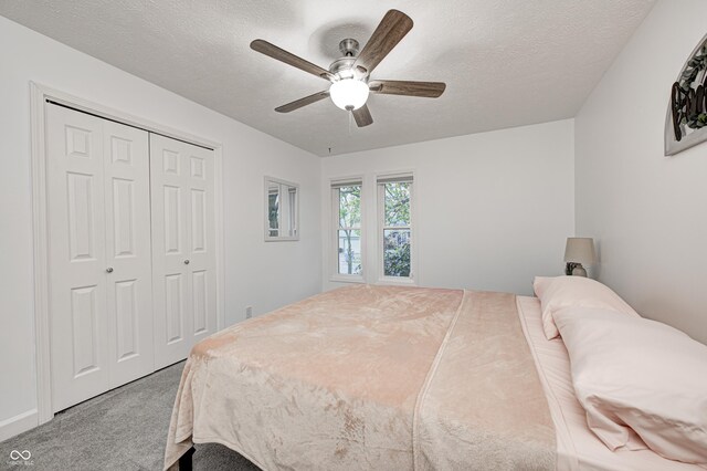 5909 Buttonwood Dr, Noblesville, IN 46062 - carpeted bedroom featuring a closet, a ceiling fan, and a textured ceiling