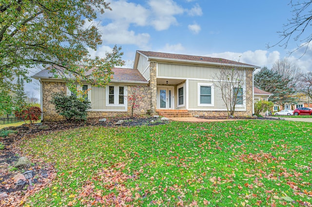 5909 Buttonwood Dr, Noblesville, IN 46062 - view of front facade featuring stone siding and a front lawn