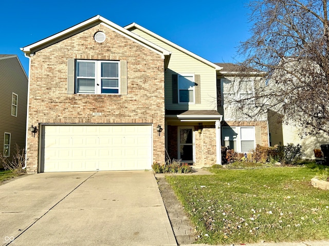 view of front property with a front yard and a garage