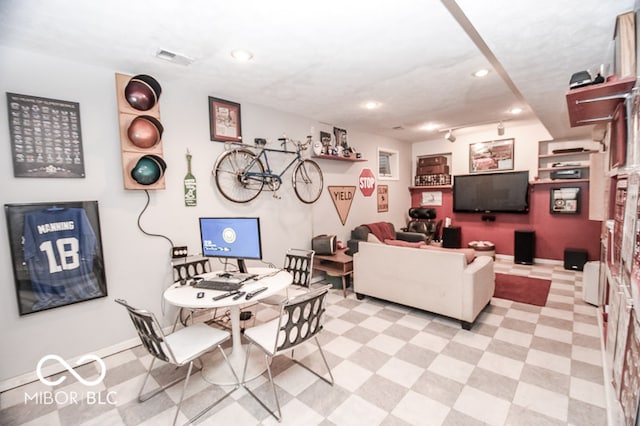 living room featuring light floors, baseboards, visible vents, and recessed lighting