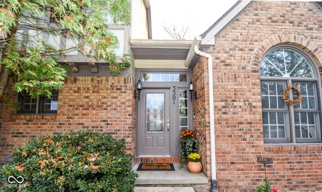 property entrance with brick siding