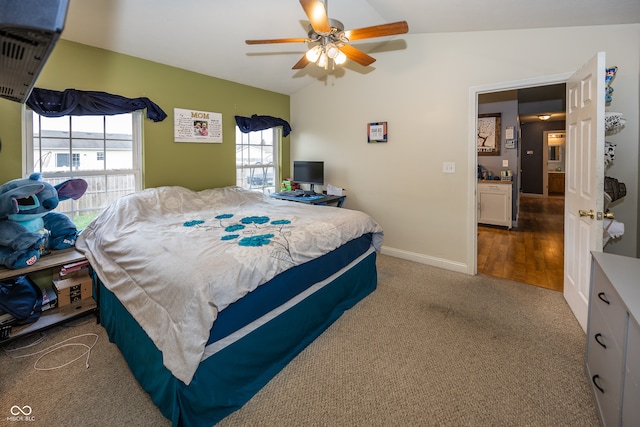 bedroom featuring hardwood / wood-style flooring, ceiling fan, and vaulted ceiling