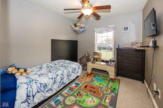 carpeted bedroom with ceiling fan