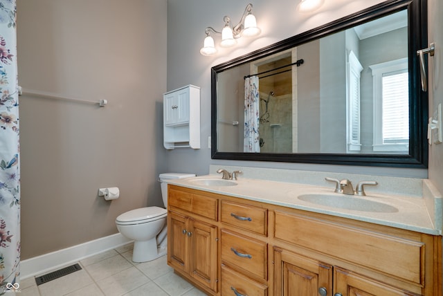 bathroom featuring tile patterned flooring, curtained shower, vanity, and toilet