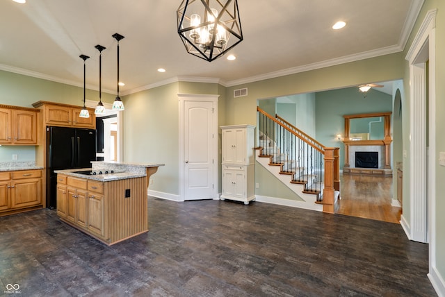 kitchen featuring light stone counters, crown molding, hanging light fixtures, dark wood-type flooring, and a center island