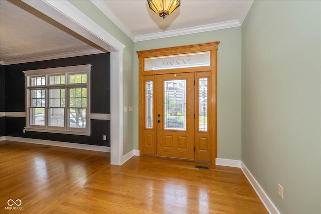 7290 Lockford Walk N, Avon, IN 46123 - foyer featuring light wood-type flooring and crown molding