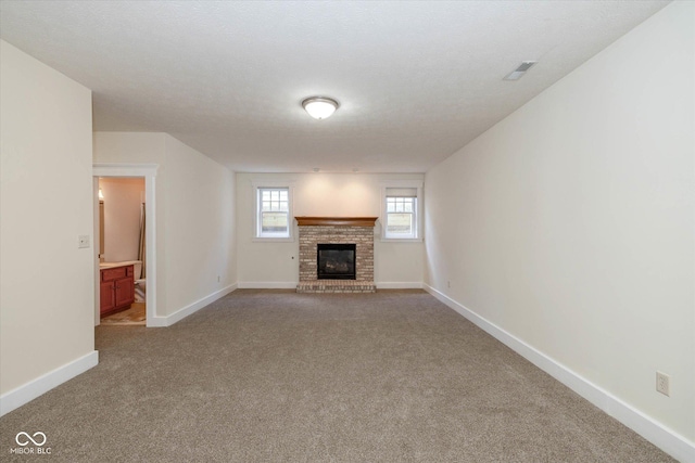 7290 Lockford Walk N, Avon, IN 46123 - unfurnished living room with carpet and a brick fireplace