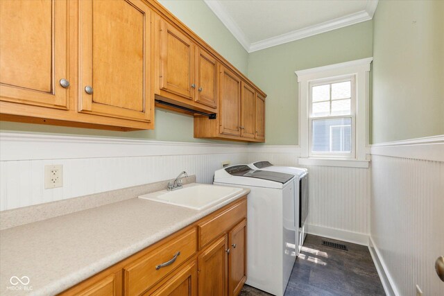 7290 Lockford Walk N, Avon, IN 46123 - laundry area featuring wainscoting, cabinet space, crown molding, and separate washer and dryer