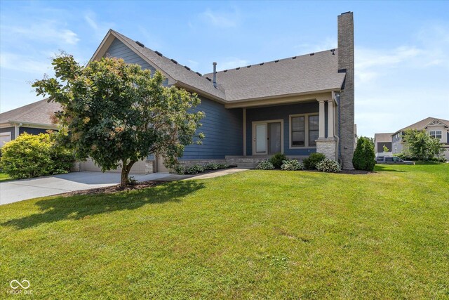 7290 Lockford Walk N, Avon, IN 46123 - view of front of property with concrete driveway, a front yard, a chimney, and an attached garage