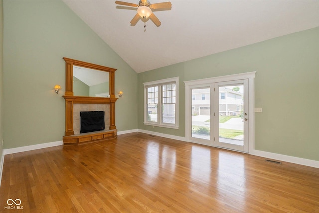 7290 Lockford Walk N, Avon, IN 46123 - unfurnished living room with light wood finished floors, a fireplace, lofted ceiling, and ceiling fan