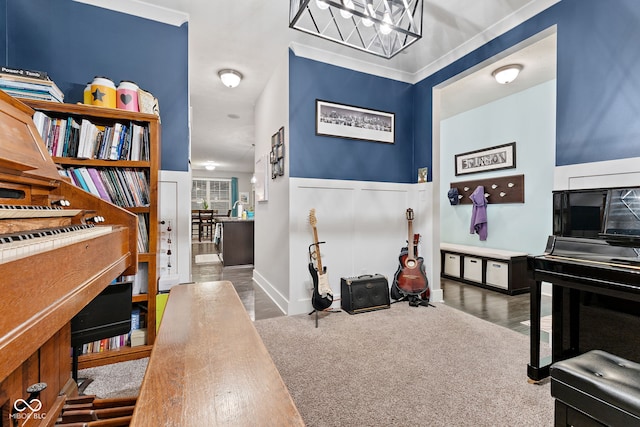 entryway with dark hardwood / wood-style flooring and crown molding