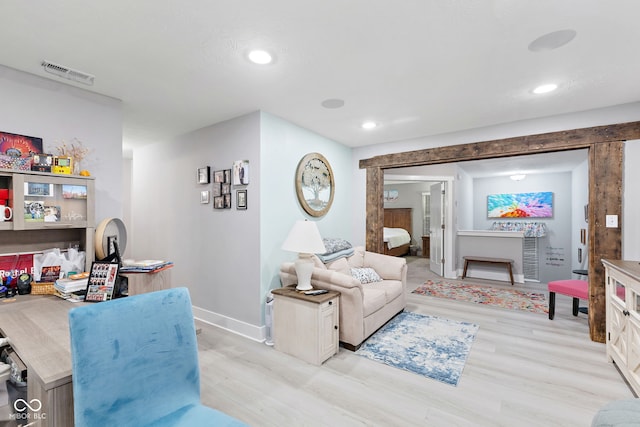 living room with light hardwood / wood-style floors