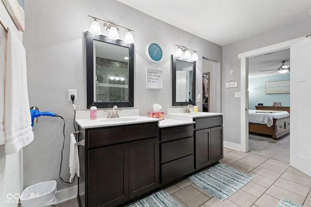 bathroom with tile patterned floors, ceiling fan, and vanity