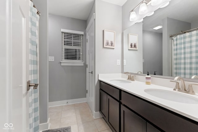 bathroom featuring tile patterned flooring and vanity