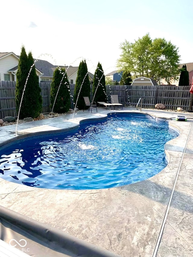 view of swimming pool featuring a patio area