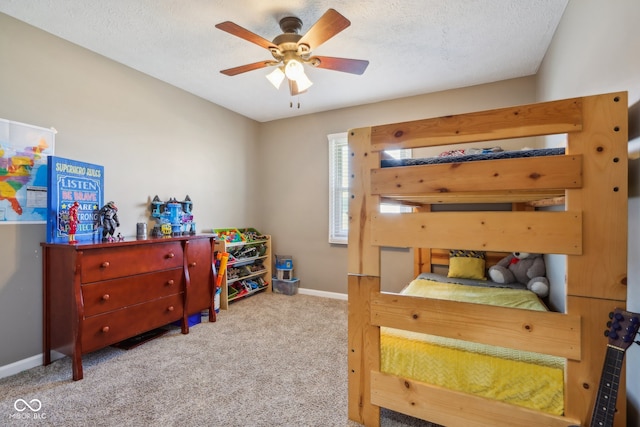 bedroom featuring a textured ceiling, carpet floors, and ceiling fan