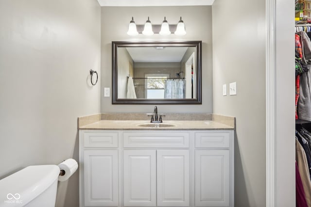 bathroom featuring vanity and toilet