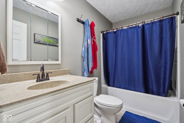 full bathroom with toilet, shower / bath combo, vanity, and a textured ceiling