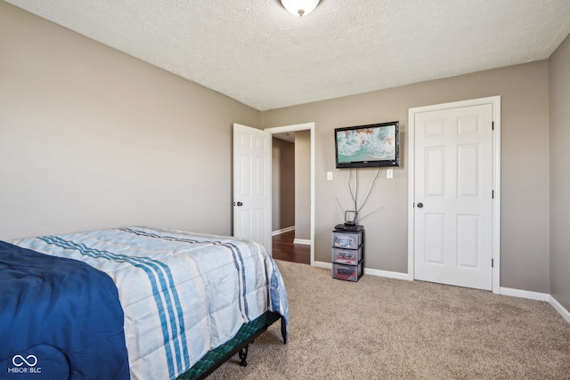 carpeted bedroom with a textured ceiling