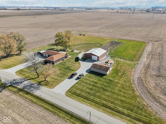 birds eye view of property with a rural view