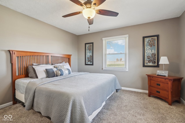 bedroom with light carpet and ceiling fan