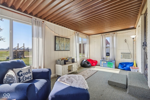 sunroom / solarium featuring an AC wall unit