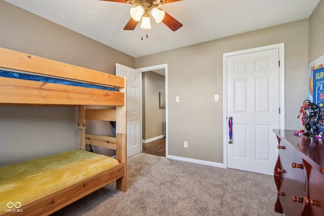 bedroom with ceiling fan and carpet flooring