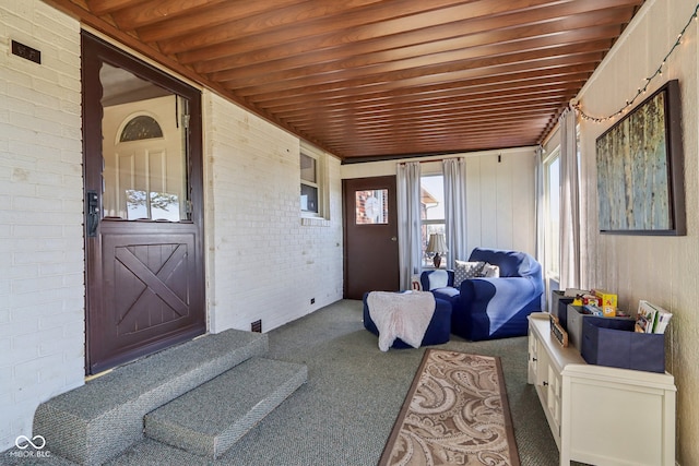 sunroom / solarium featuring wood ceiling