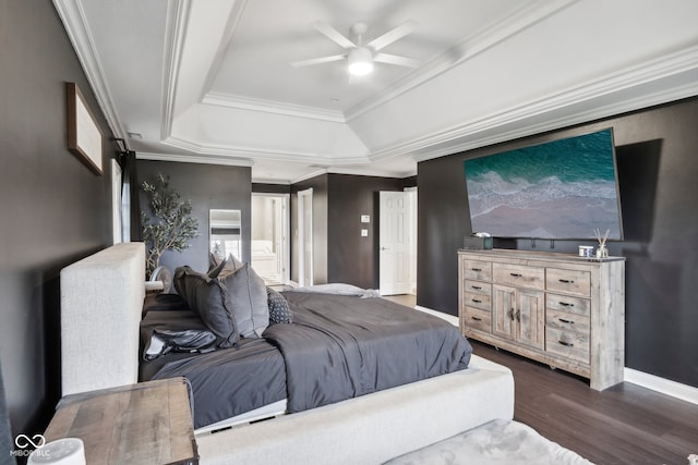 bedroom featuring a raised ceiling, ceiling fan, dark hardwood / wood-style flooring, and crown molding