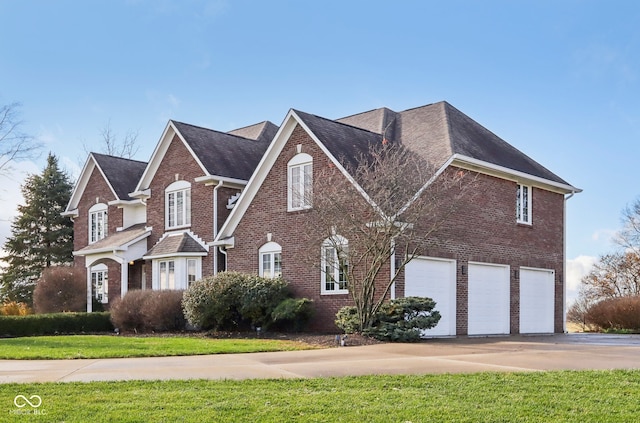 front facade featuring a garage and a front lawn