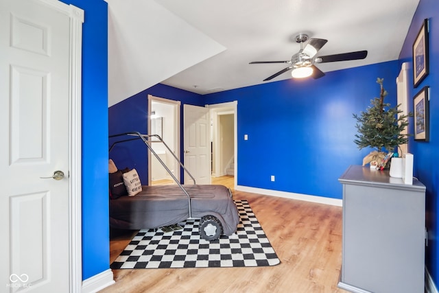 bedroom with ceiling fan and light wood-type flooring