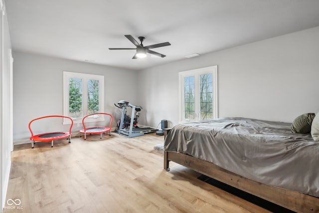 bedroom featuring hardwood / wood-style flooring and ceiling fan